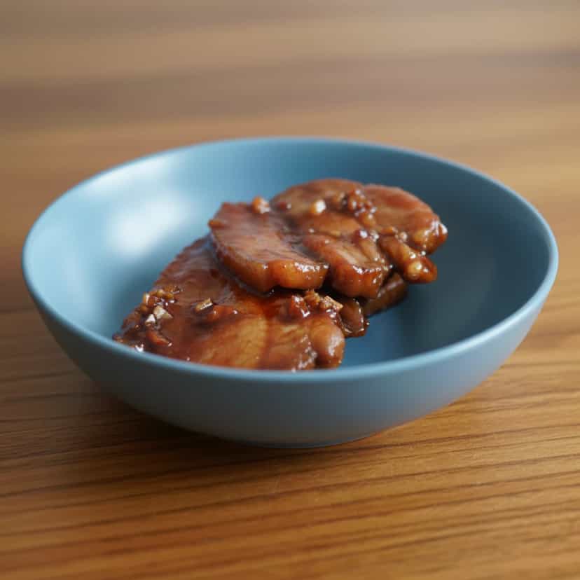 Foto deliciosa de Entremeada ao Molho Doce e Salgado pronta para servir - Carnes & Frango