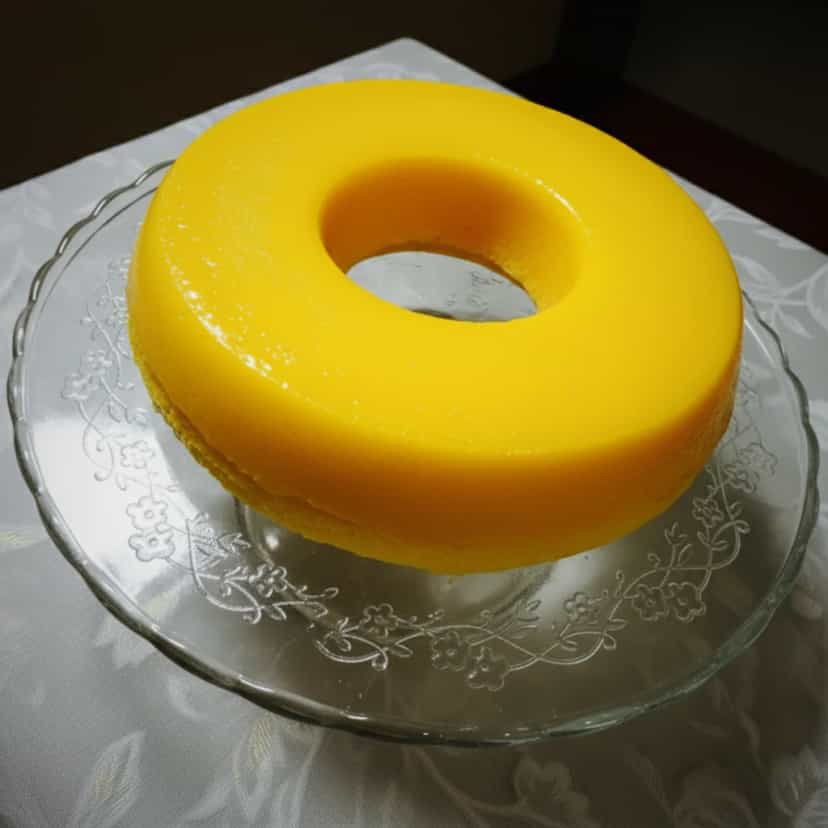 Foto deliciosa de Quindim Tradicional pronta para servir - Pudins & Cremes