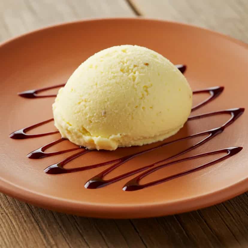 Foto deliciosa de Sorvete Cremoso de Milho com Coco pronta para servir - Doces Gelados & Sorvetes